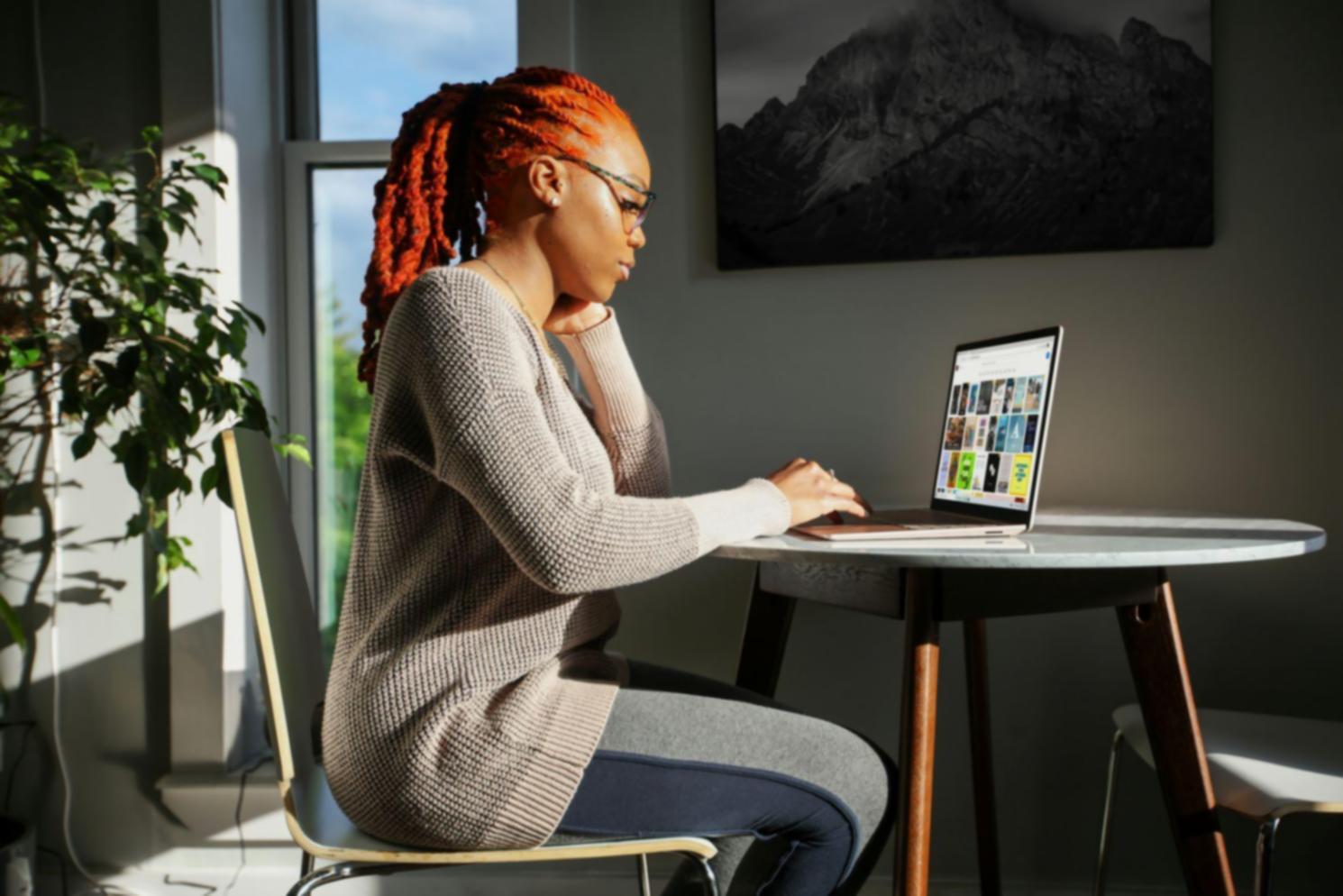Financial analyst reviewing business performance charts and metrics on computer screen
